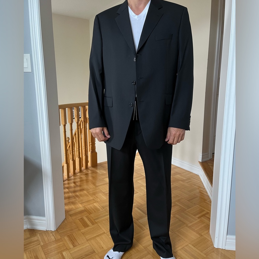 New with tags - never worn Hugo Boss suit purchased in Paris. Dark grey colour